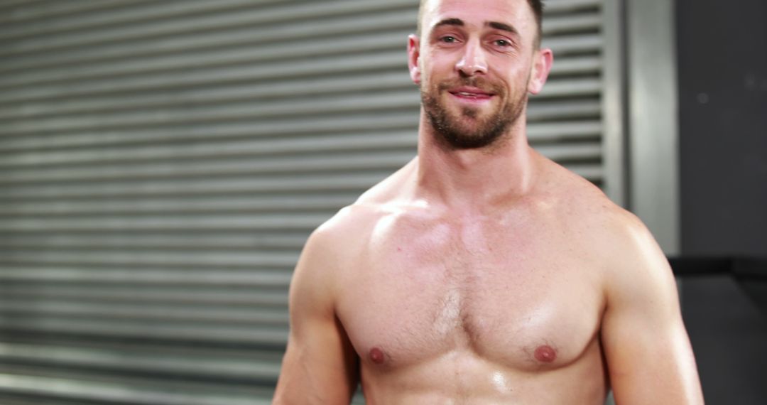 A shirtless Caucasian young man is smiling at the camera, after a workout, with copy space - Free Images, Stock Photos and Pictures on Pikwizard.com