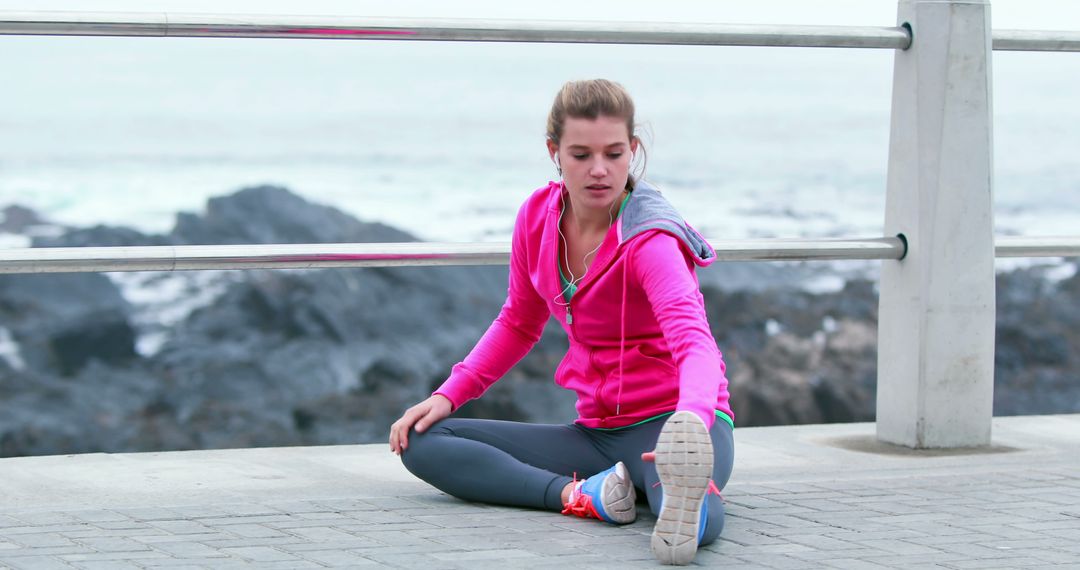 Young Woman Stretching Before Morning Jog by Oceanfront - Free Images, Stock Photos and Pictures on Pikwizard.com