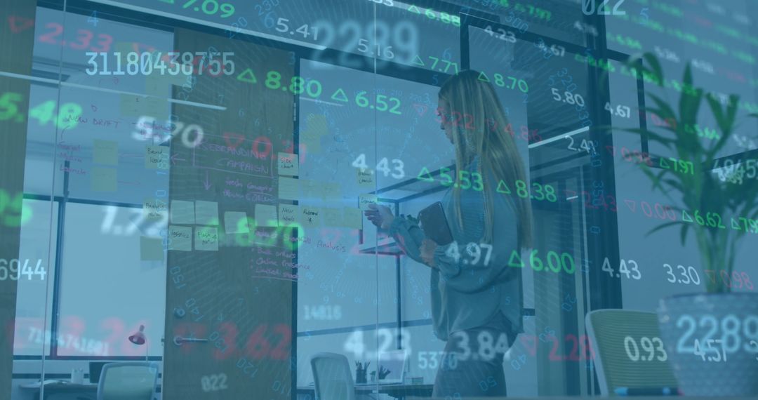 Businesswoman Working with Financial Data in Office Environment