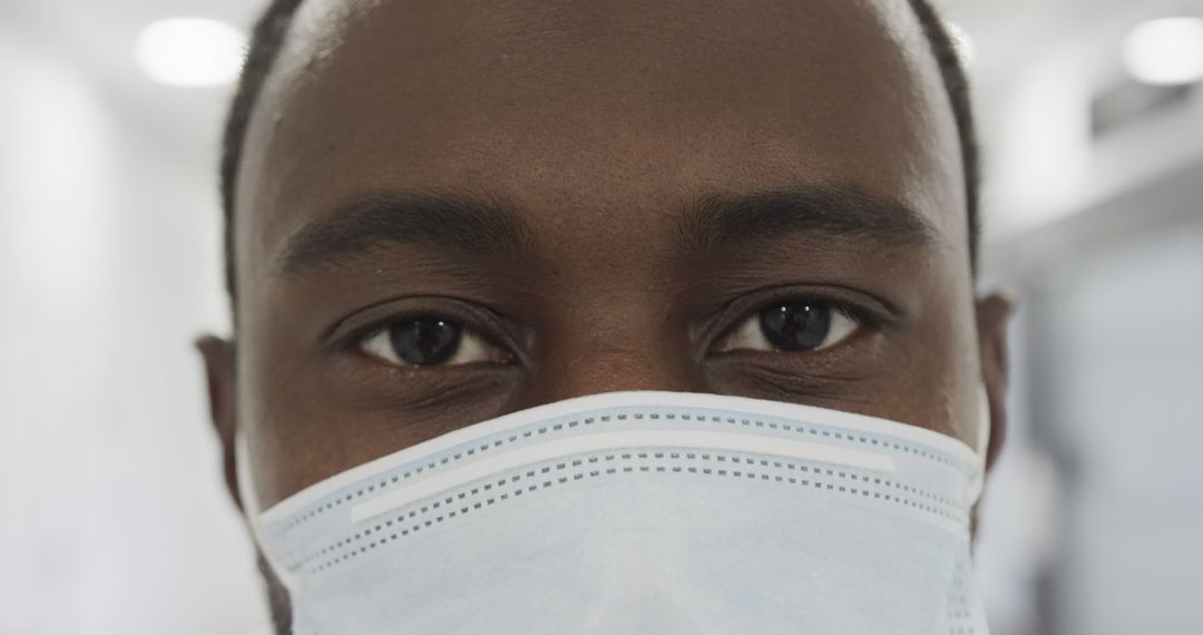 Close Up of African American Doctor Wearing Face Mask - Free Images, Stock Photos and Pictures on Pikwizard.com