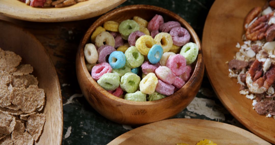 Colorful Breakfast Cereal Rings in Wooden Bowl on Table - Free Images, Stock Photos and Pictures on Pikwizard.com