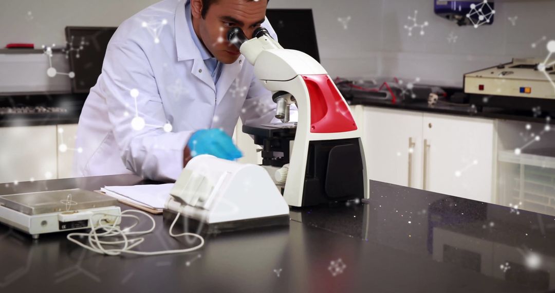 Scientist Examining Specimen with Microscope in Modern Laboratory