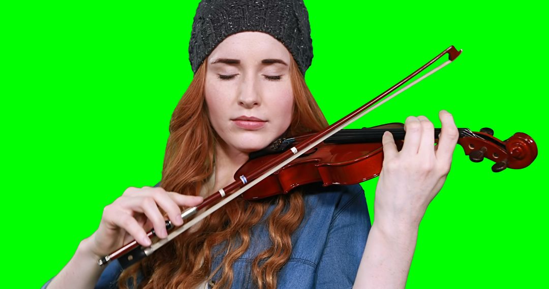 Woman with Red Hair Playing Violin Against Green Screen - Free Images, Stock Photos and Pictures on Pikwizard.com