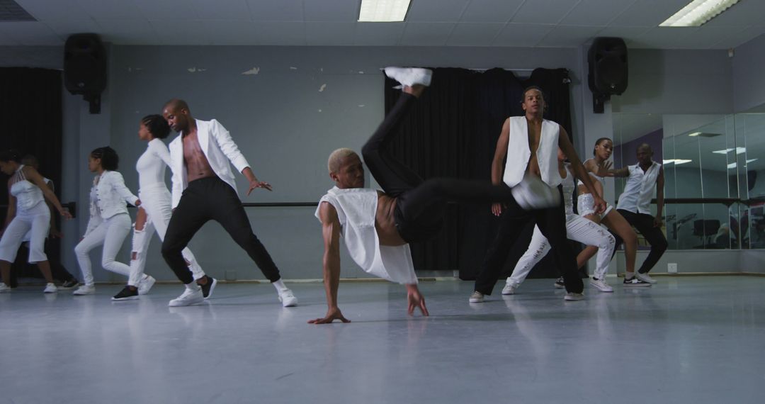 Energetic Dance Crew Performing Hip Hop Choreography in Studio - Free Images, Stock Photos and Pictures on Pikwizard.com