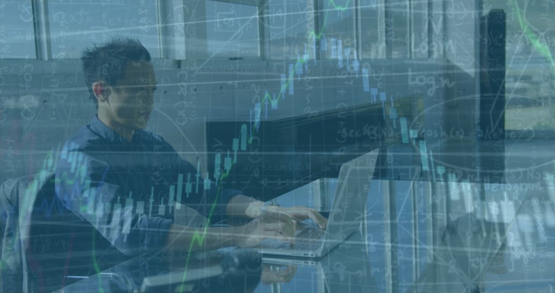 Engineer Analyzing Financial Data on Laptop Tied to Technology