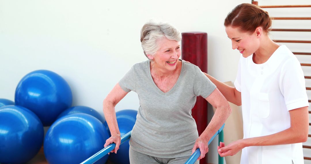 Happy Elderly Woman Receiving Physical Therapy With Caregiver - Free Images, Stock Photos and Pictures on Pikwizard.com