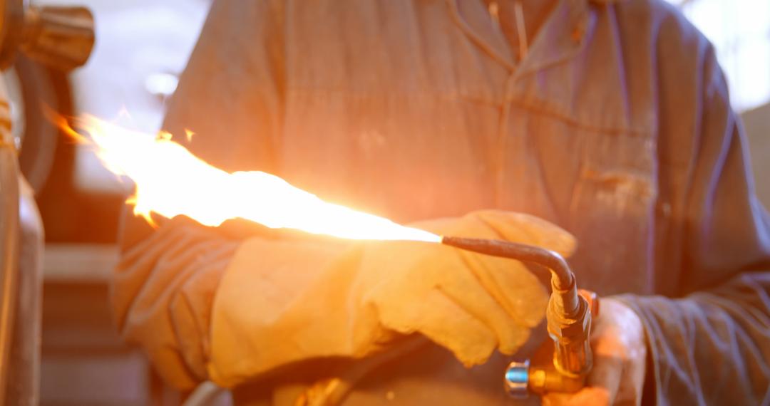 Welder Holding Torch in Factory for Car Industry Work - Free Images, Stock Photos and Pictures on Pikwizard.com