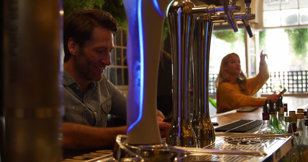 Caucasian Couple Socializing at Hotel Bar with Drinks