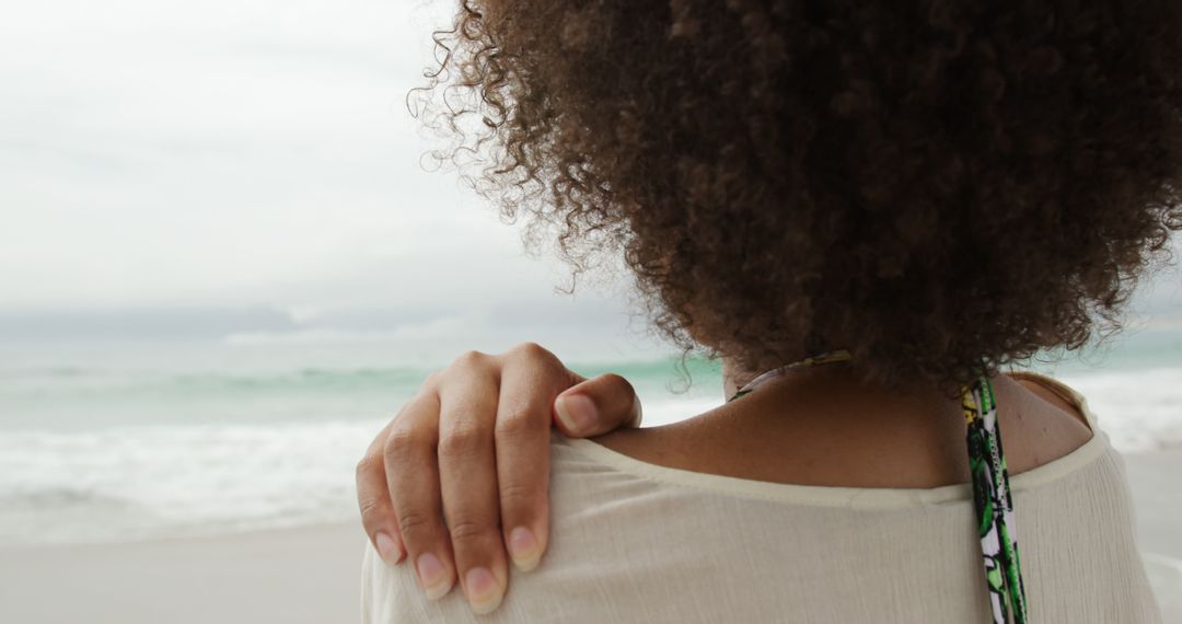 Serene Woman Enjoying Peaceful Beach View - Free Images, Stock Photos and Pictures on Pikwizard.com