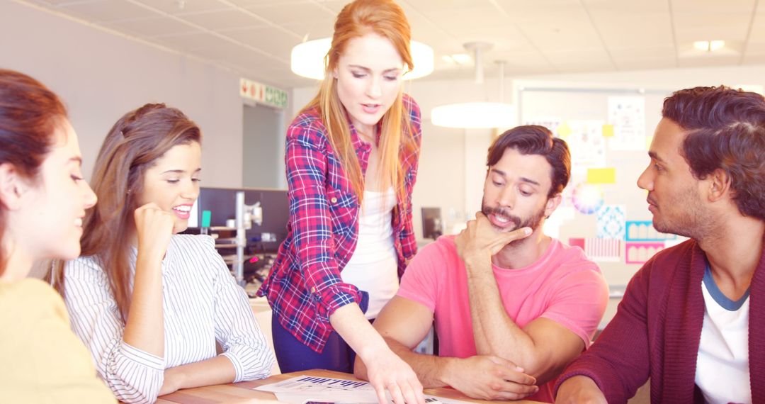 Young Professionals Team Collaborating in Creative Office