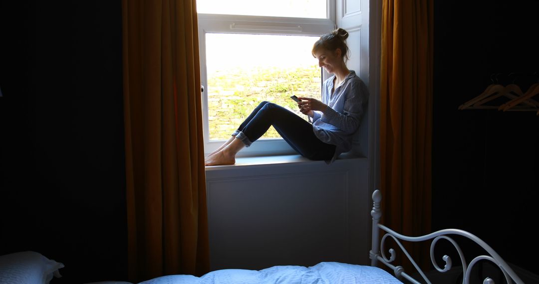 Woman Taking Selfie in Brightly Lit Window Nook
