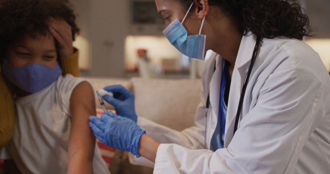 Pediatrician Vaccinating Young Boy at Home During Pandemic - Free Images, Stock Photos and Pictures on Pikwizard.com