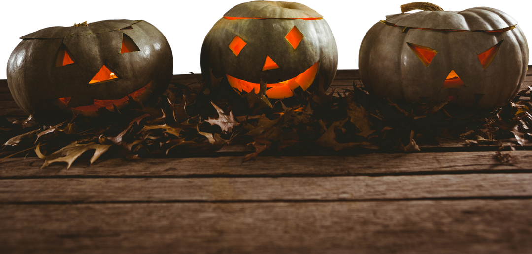 Spooky Jack O'Lanterns with Glowing Faces on Wood Table Top View with Transparent Background - Download Free Stock Images Pikwizard.com