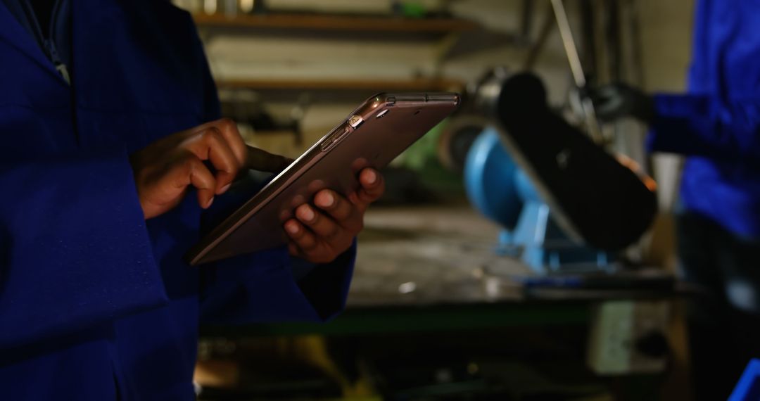 Engineer Using Tablet in Industrial Workshop - Free Images, Stock Photos and Pictures on Pikwizard.com