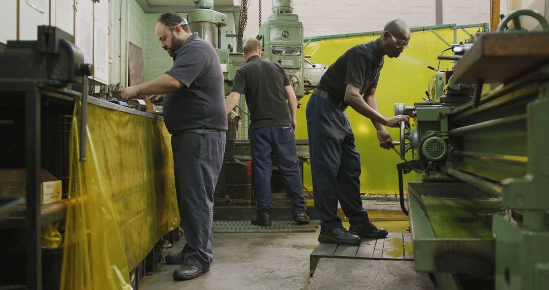 Workers Minding Machines in Industrial Manufacturing Factory - Free Images, Stock Photos and Pictures on Pikwizard.com