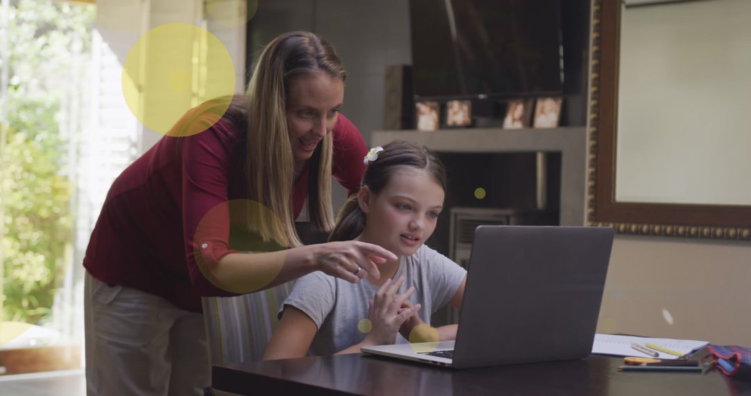 Mother and Daughter Bond Over Learning with Laptop