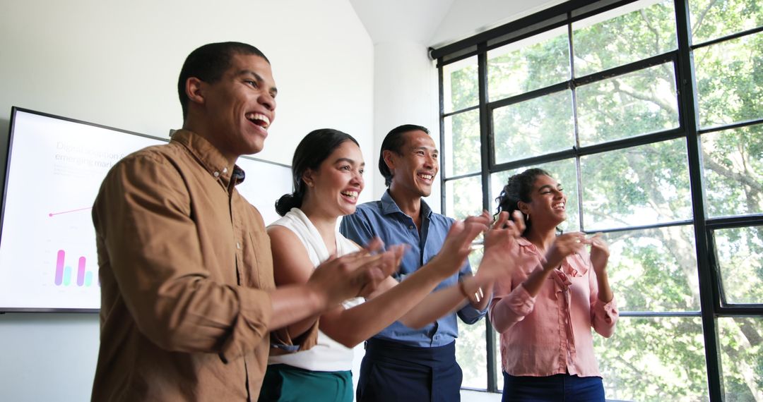 Diverse Colleagues Celebrating in Modern Office Setting