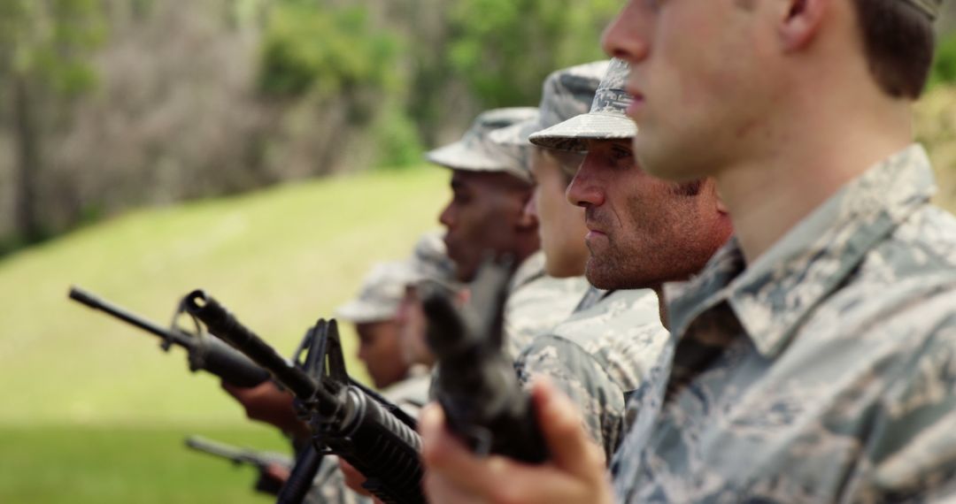 Focused Military Personnel Training with Rifles Outdoors - Free Images, Stock Photos and Pictures on Pikwizard.com