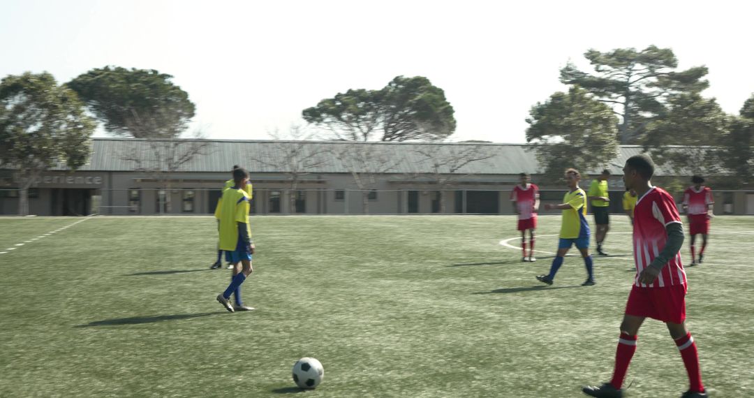 Soccer Players Strategizing on Field for Upcoming Match