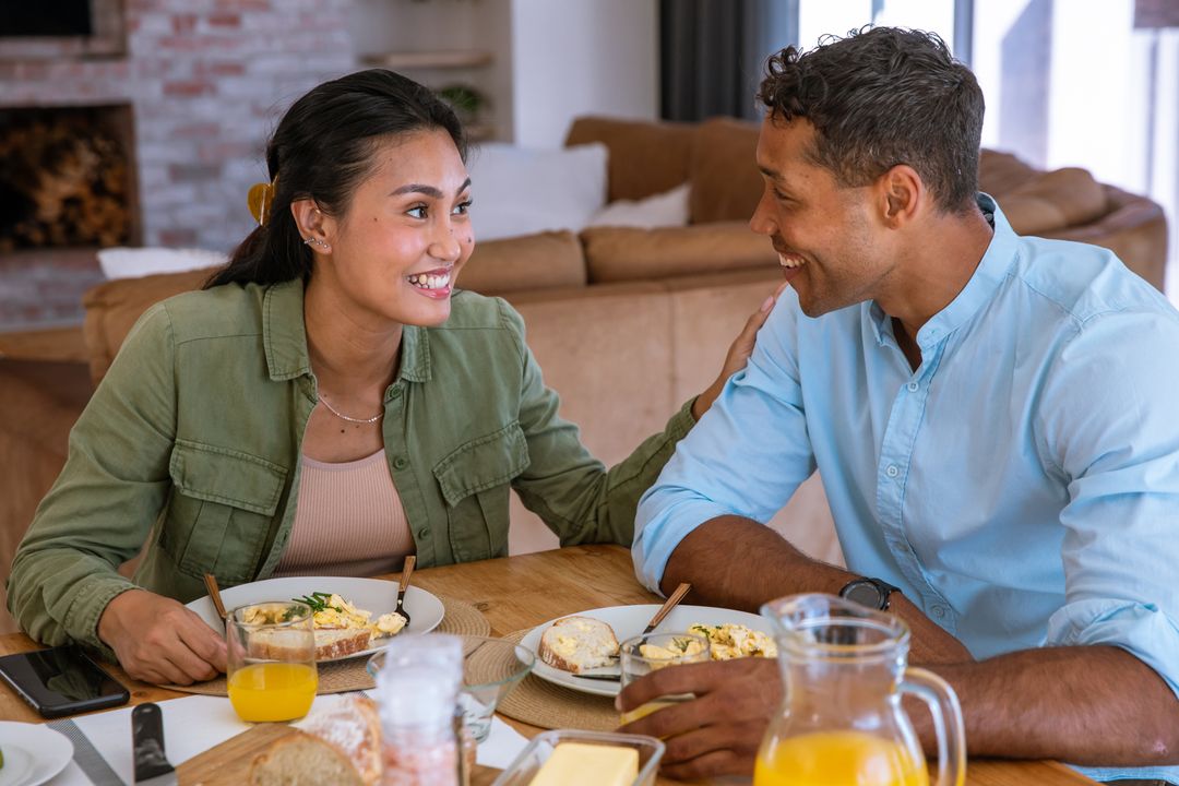 Diverse Couple Sharing Breakfast at Cozy Home Setting