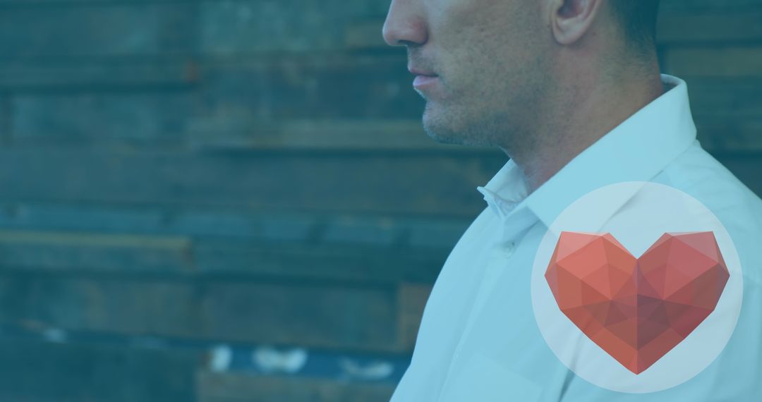 Focused Businessman Laptops with Digital Heart Icon Overlay