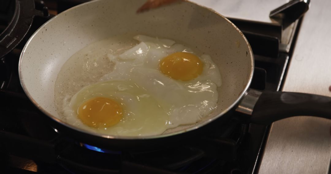 Cooking Sunny Side Up Eggs in Frying Pan on Gas Stove - Free Images, Stock Photos and Pictures on Pikwizard.com