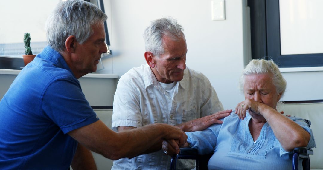 Senior Woman in Emotional Moment Comforted by Two Elderly Men Indoor - Free Images, Stock Photos and Pictures on Pikwizard.com