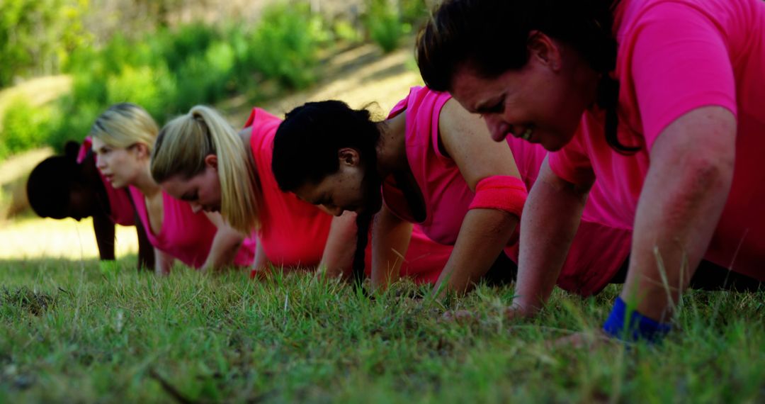 Group of Diverse Women Exercising Outdoors in Pink Shirts - Free Images, Stock Photos and Pictures on Pikwizard.com