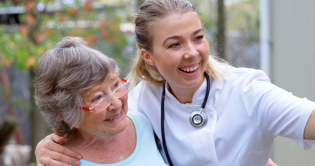 Senior Woman and Nurse Smiling Together Outdoors - Free Images, Stock Photos and Pictures on Pikwizard.com