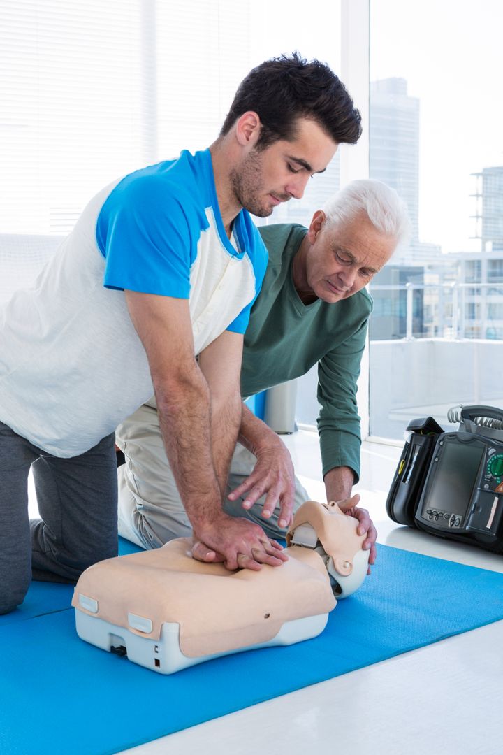 Paramedic training cardiopulmonary resuscitation to man - Free Images, Stock Photos and Pictures on Pikwizard.com