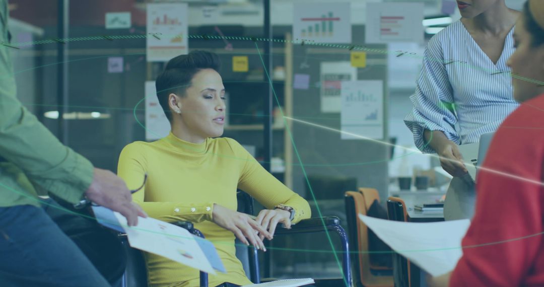 Diverse Team Discussing Business Strategies and Graphs Together