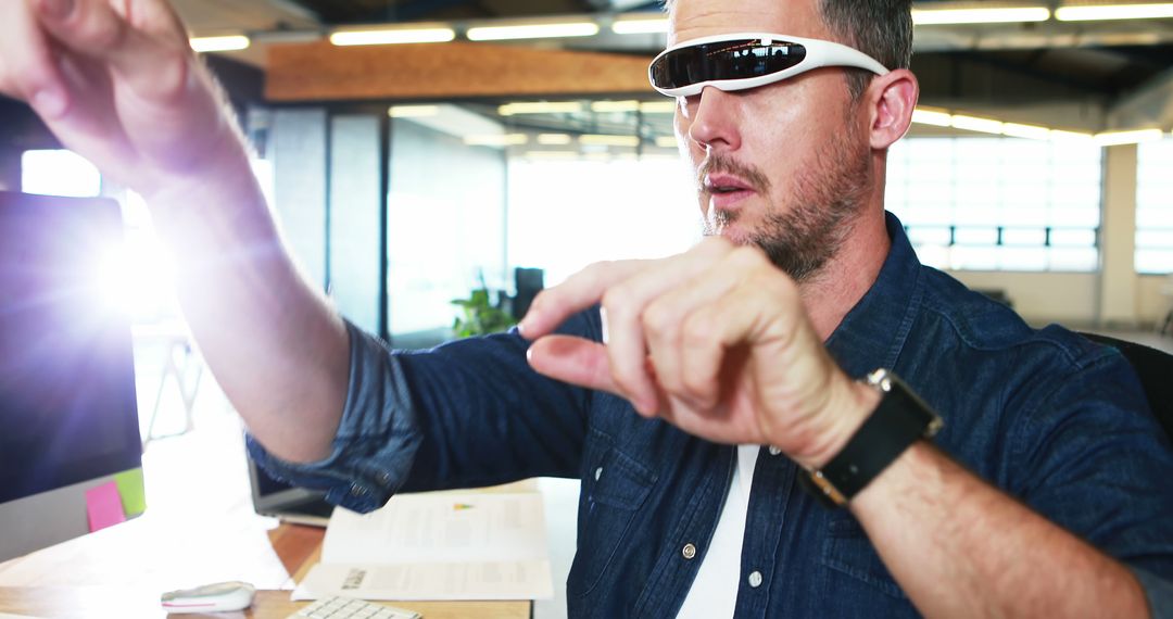 Man Using Augmented Reality Glasses in Modern Office - Free Images, Stock Photos and Pictures on Pikwizard.com