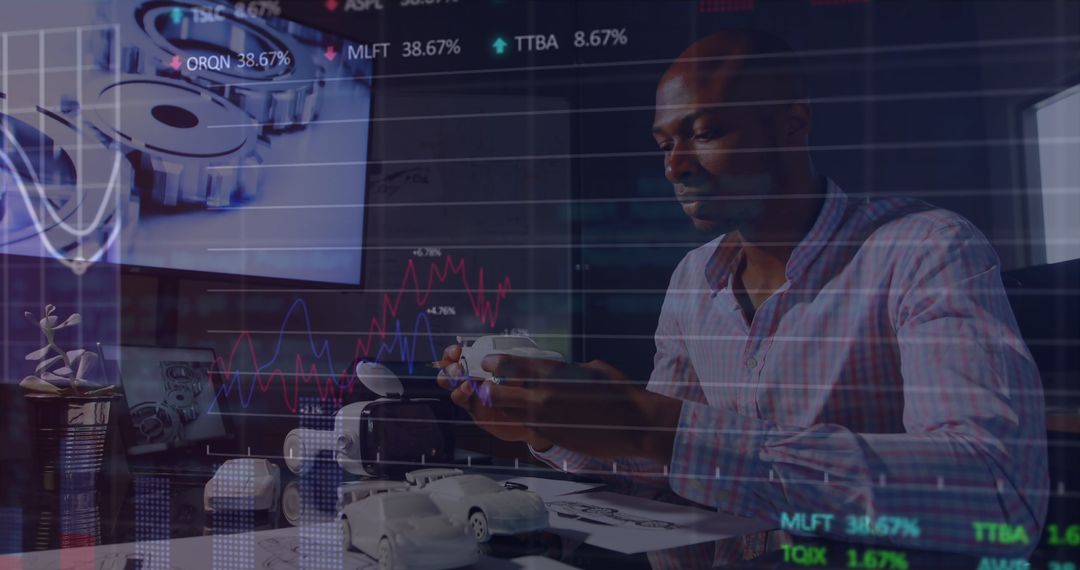 African American Businessman Analyzing Financial Data with Virtual Interface