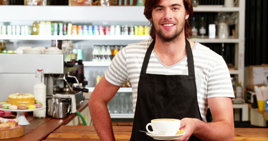 Barista Holding Coffee Cup in Trendy Café - Free Images, Stock Photos and Pictures on Pikwizard.com