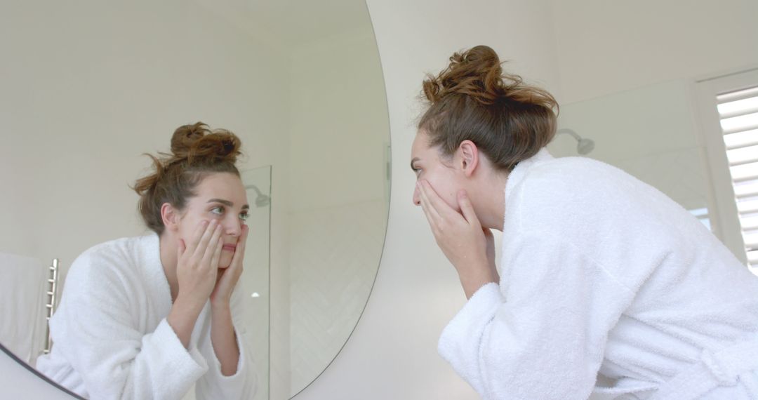 Young Woman Checking Skin in Bathroom Mirror - Free Images, Stock Photos and Pictures on Pikwizard.com