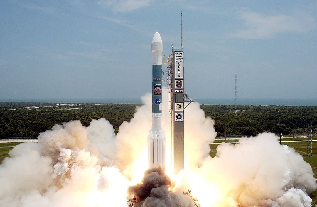 KENNEDY SPACE CENTER, FLA. -   With a glimpse of the Atlantic Ocean over the horizon, the Delta II rocket with its Mars Exploration Rover (MER-A) payload leaps off the launch pad into the blue sky to begin its journey to Mars.  Liftoff occurred on time at - Free Images, Stock Photos and Pictures on Pikwizard.com