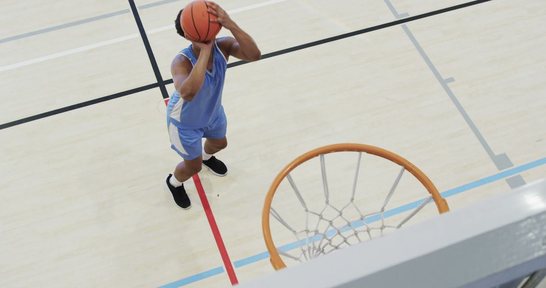 Young Male Basketball Player Shooting Above View - Free Images, Stock Photos and Pictures on Pikwizard.com