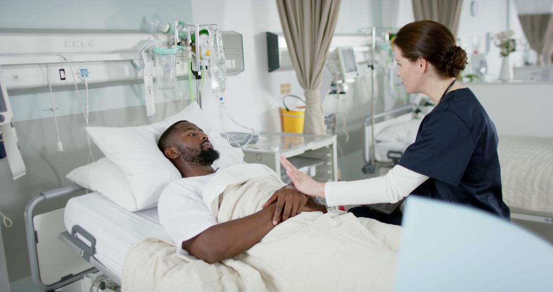 Nurse Checking on Patient in Hospital Bed - Free Images, Stock Photos and Pictures on Pikwizard.com