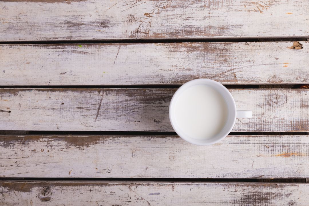 Cup of Milk on Rustic Wooden Table with Copy Space - Free Images, Stock Photos and Pictures on Pikwizard.com