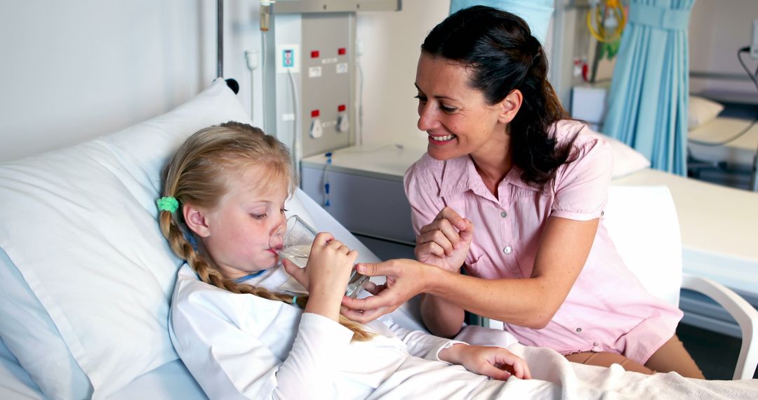 Mother Feeding Daughter Hospital Bedside Smile - Free Images, Stock Photos and Pictures on Pikwizard.com