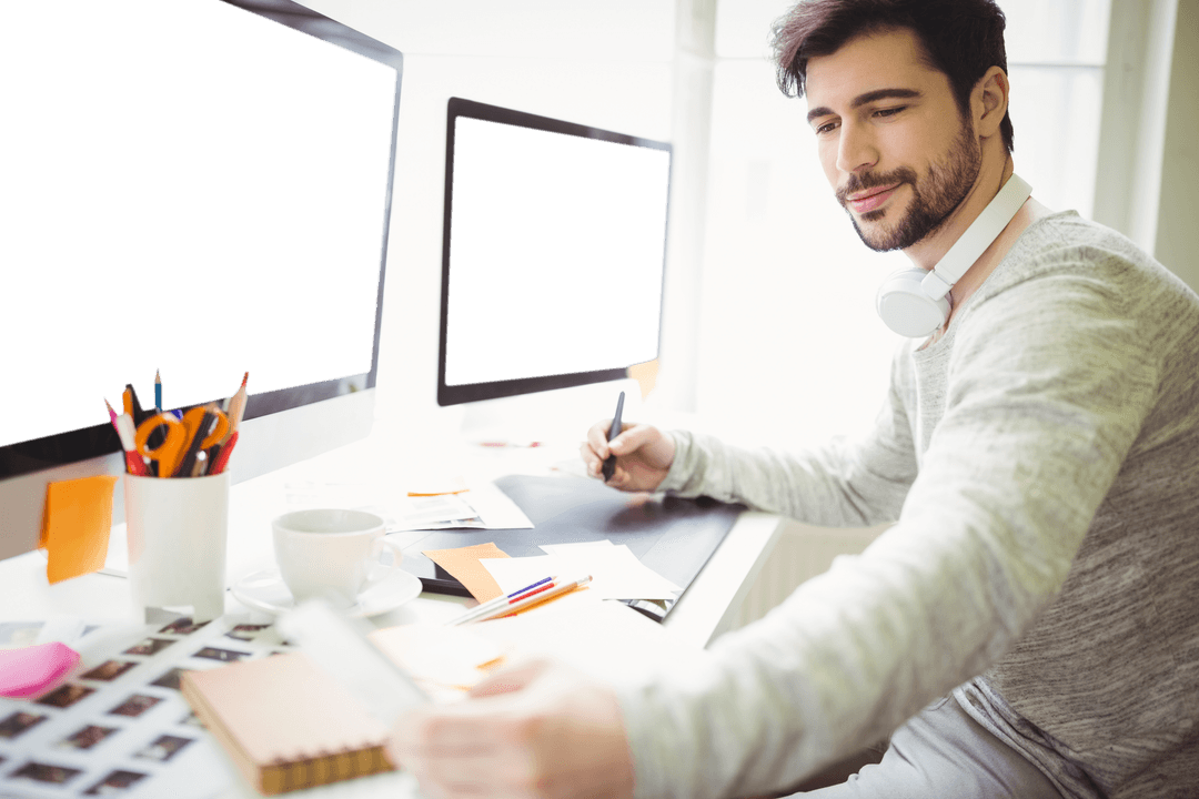 Graphic Designer in Transparent Creative Workspace with Modern Devices