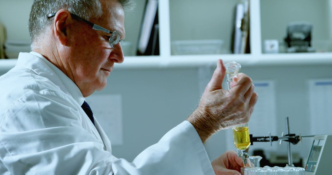 Male Scientist Conducting Laboratory Experiment with Test Tube - Free Images, Stock Photos and Pictures on Pikwizard.com