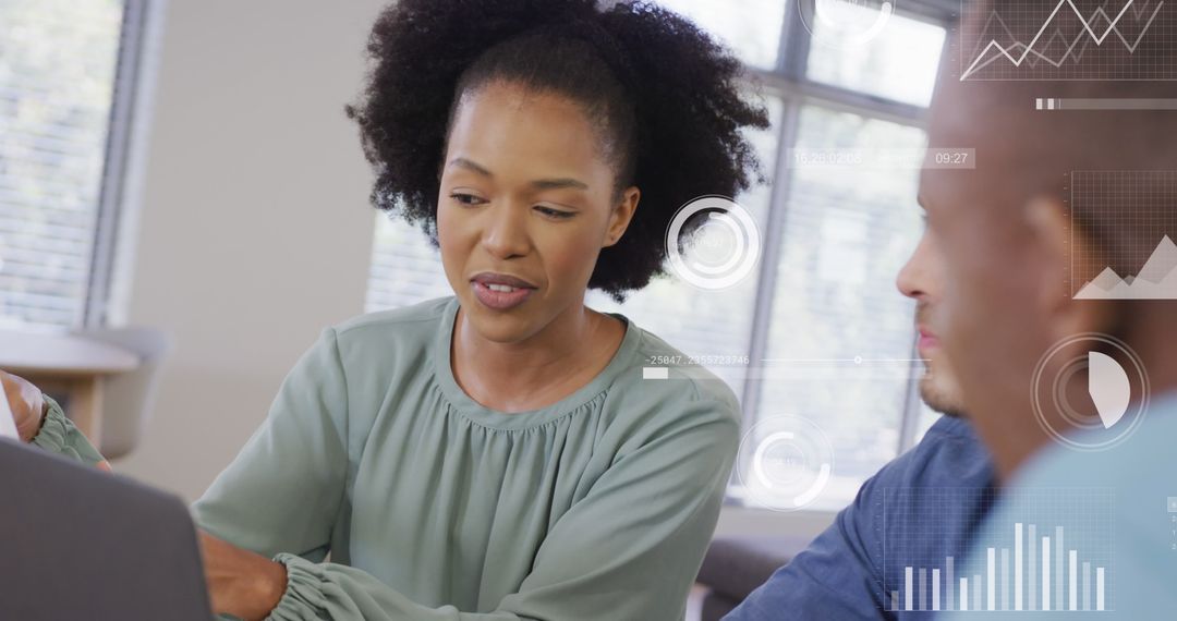 Business Colleagues Analyzing Financial Data with Digital Interface