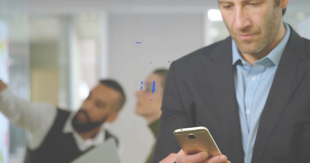 Businessman Using Smartphone in Modern Corporate Environment