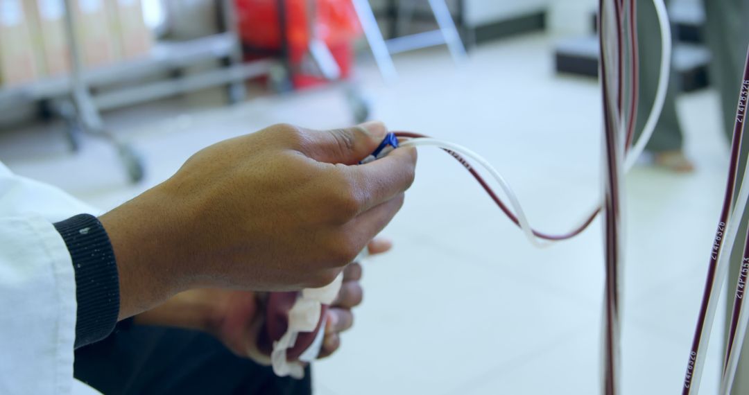 Close-up of Medical Professional Handling Blood Tubing in Hospital - Free Images, Stock Photos and Pictures on Pikwizard.com