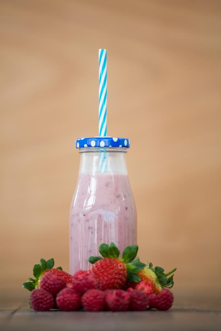 Fresh Berry Smoothie in Glass Bottle with Straw - Free Images, Stock Photos and Pictures on Pikwizard.com