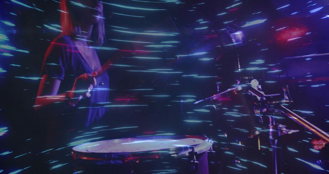 Percussionist Playing Drums with Dynamic Light Trails on Stage