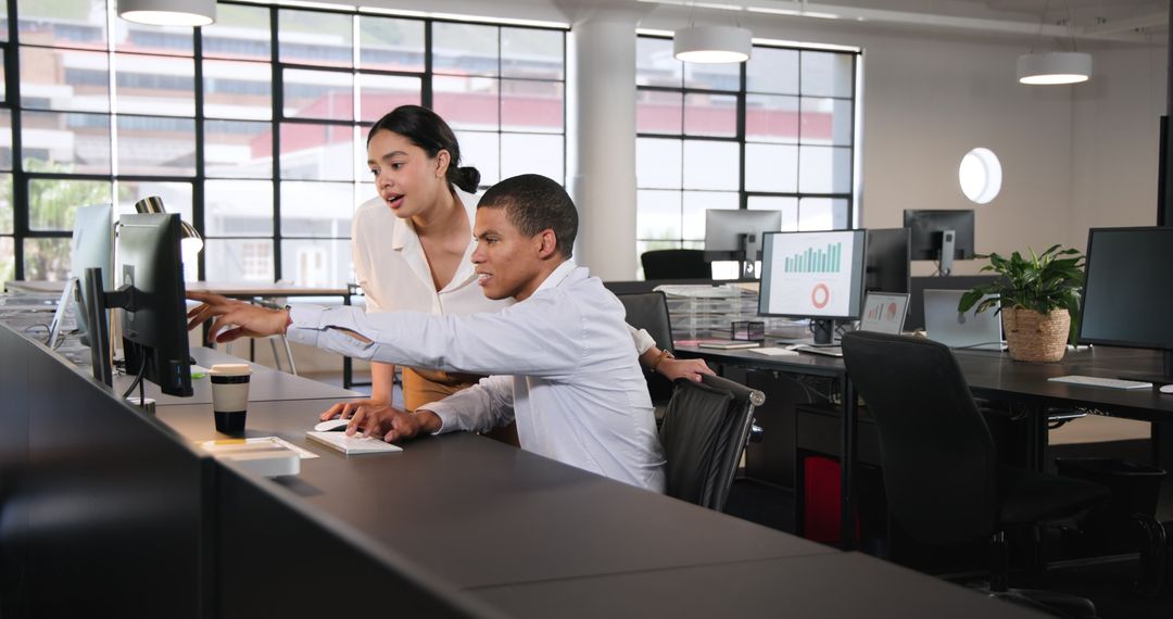 Multiracial Business Team Collaborating on Project in Contemporary Office