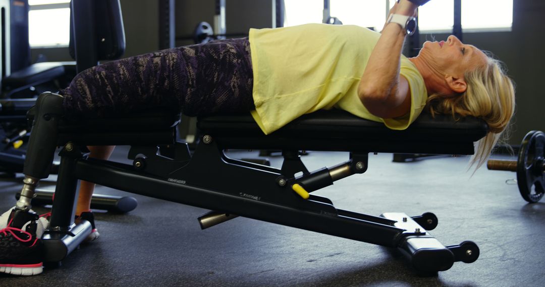 Senior Woman Lifting Weights on Incline Bench at Gym - Free Images, Stock Photos and Pictures on Pikwizard.com