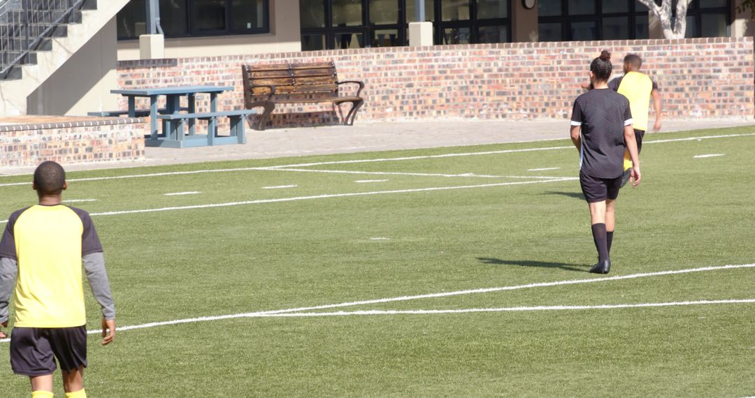 Soccer Practice on Field with Teamwork and Skill Development